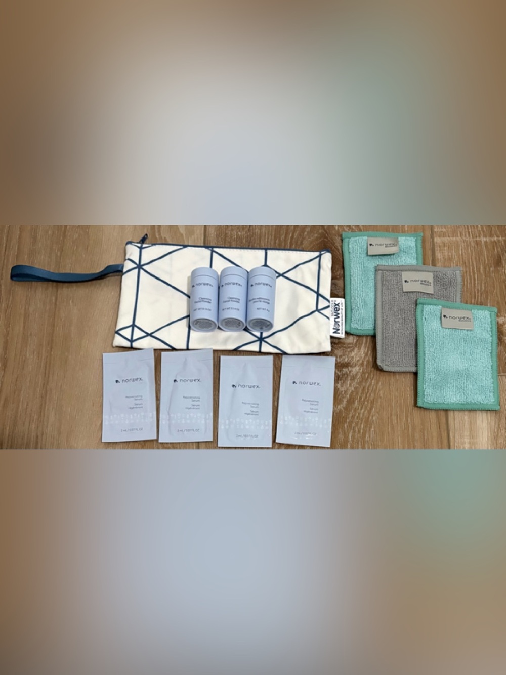 NORWEX ( 3 ) FACIAL POWDER (4) SERUM PACKET (3) BODY FACE CLOTHS & WRISTLET LOT